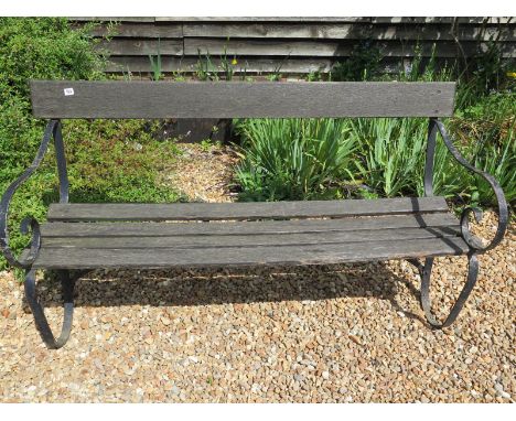 A vintage wrought iron garden bench