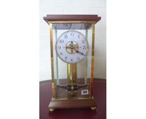 A Bulle four glass electric mantle clock with a cream dial and skeletonised centre - in good working order