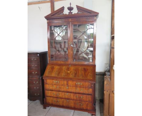 A Good qaulity mahogany inlaid bureau with an  astragal glazed bookcase top, the fall front opening to reveal a fitted interi