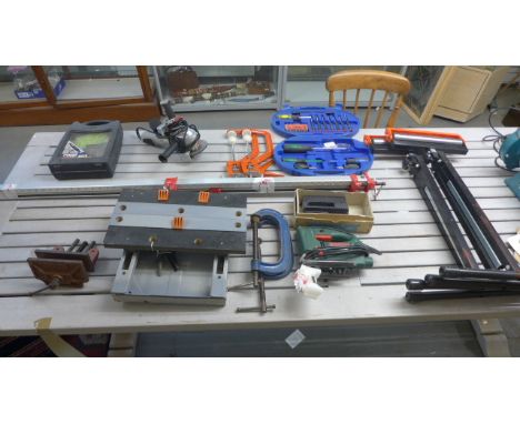 A quantity of tools including clamps, a vice, a Bosch jigsaw, a grinder
