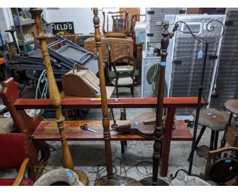 Three early to mid 20th century turned wooden standard lamps and a wrought iron standard lamp Location: G 