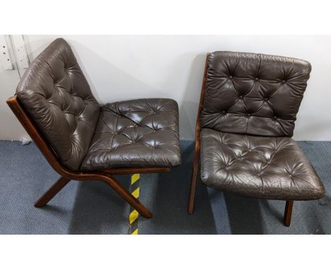 A pair of 1970's Ekornes Uno folding chairs with brown button leather upholsteryLocation: 