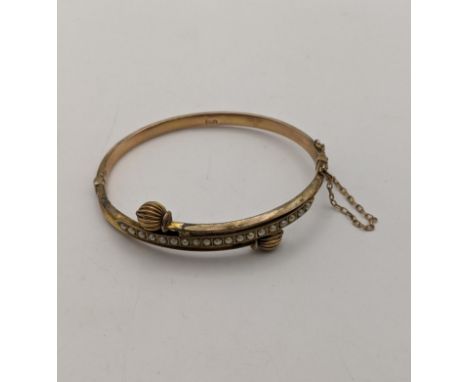 A 9ct gold and gold plated hinged bangle A/F, total weight 9g Location: 