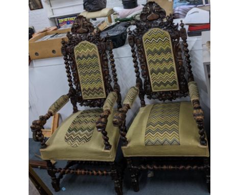 A pair of late 19th century carved oak throne style chairs with barley twist columns and tapestry upholsteryLocation: 
