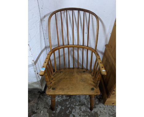 A 19th century Windsor stick back armchair on turned legs and elliptical H-stretchers Location: 
