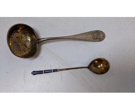 A Russian silver gilt and enamel teaspoon and a sifter spoon, 98g Location: 