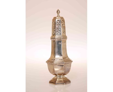 A GEORGE V SILVER SUGAR CASTER, BIRMINGHAM 1913, in 18th Century style, of faceted baluster form with stepped octagonal foot.