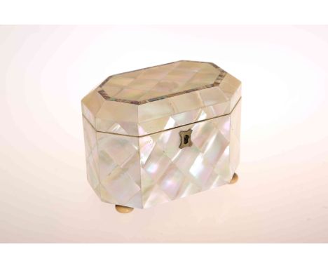 A MID VICTORIAN MOTHER-OF-PEARL TEA CADDY, of canted rectangular form, the hinged cover embellished with abalone banding, the