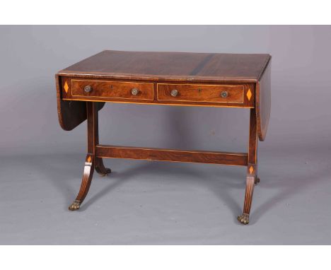 A REGENCY SATINWOOD AND ROSEWOOD SOFA TABLE, the crossbanded top with drop ends with rounded corners above a pair of frieze d