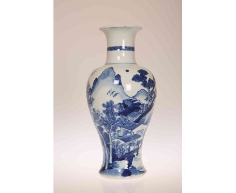 A CHINESE BLUE AND WHITE BALUSTER VASE, painted in the round with figures in a mountainous landscape, artemisia leaf mark wit