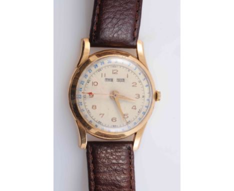 AN 18 CARAT GOLD TRIPLE DATE CALENDAR MANUAL WIND WRISTWATCH, circa 1940's, day and month apertures, subsidiary seconds dial.