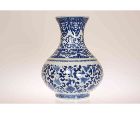 A CHINESE BLUE AND WHITE PORCELAIN VASE, of baluster form, painted with a band of Greek Key to the flared rim above bands of 