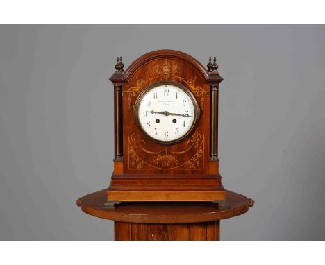 AN EDWARDIAN INLAID MAHOGANY MANTEL CLOCK, S. SMITH & SON LTD, 104 STRAND, LONDON, the arch-top case with inlaid front, white