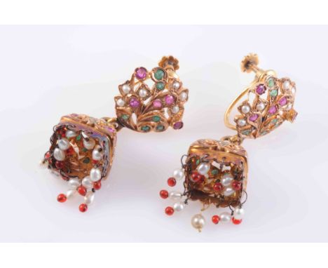 A PAIR OF INDIAN RUBY, EMERALD AND SEED PEARL EARRINGS, the heavily moulded domed tassel with pierced detailing set throughou