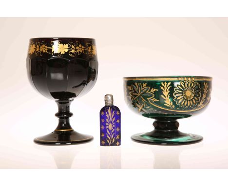 A 19th CENTURY GILT-DECORATED AMETHYST GLASS GOBLET, the rim painted with a gilt band of grapes and vine leaves above a panel