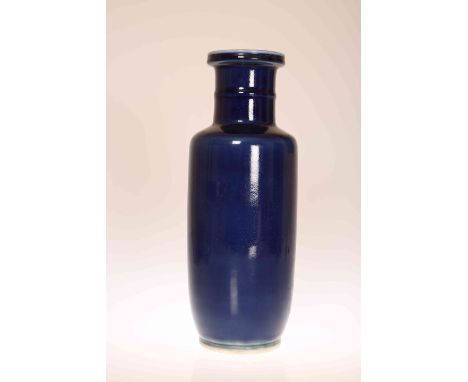 A CHINESE BLUE GLAZED PORCELAIN ROULEAU VASE OF KANGXI TYPE, of characteristic form, with rib-moulded neck and double ring ma