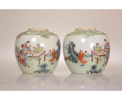 A PAIR OF CHINESE FAMILLE ROSE JARS, each enamel painted with figures at a table taking tea. 12.5cm high