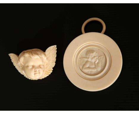 A CARVED IVORY BROOCH, LATE 19th CENTURY, POSSIBLY DIEPPE, worked as a winged putto; together with a carved ivory "miniature"