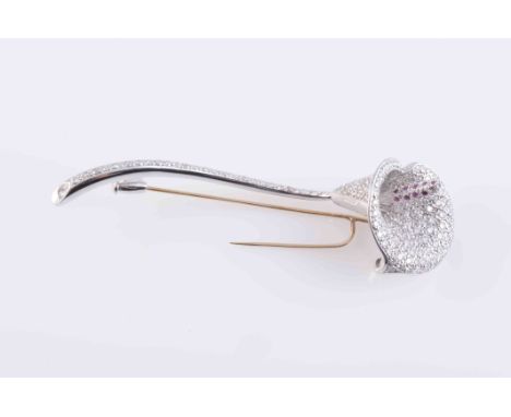 A CONTEMPORARY DIAMOND AND RUBY SET BROOCH, modelled as a calla lily, the curved stem and head set throughout with graduating
