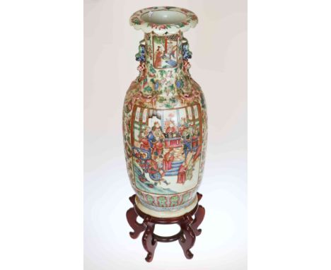 A LARGE CANTON FAMILLE ROSE PORCELAIN BALUSTER VASE, circa 1900, applied with Buddhistic lion handles and with lizards to the