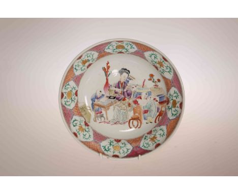 A CHINESE FAMILLE ROSE BOWL, enamel painted with a teacher and three studying boys surrounded by various objects, within a br