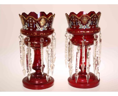 A PAIR OF 19TH CENTURY RUBY GLASS TABLE LUSTRES, each with crown top and enamel painted. 36cm