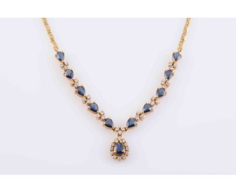 A SAPPHIRE AND DIAMOND BRACELET, the eighteen oval cut sapphires each four claw set, alternately spaced with eighteen brillia