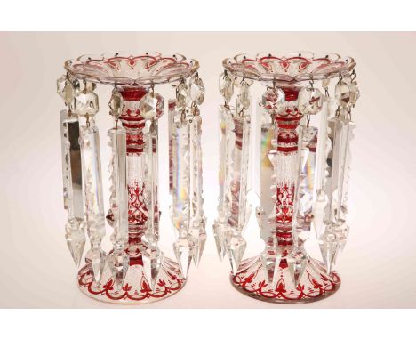 A FINE PAIR OF BOHEMIAN TABLE LUSTRES, CIRCA 1870, picked out with ruby, white and gilt, clear glass drops hanging from a sha