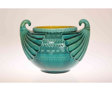 CHRISTOPHER DRESSER (1834-1904) FOR LINTHORPE POTTERY, A JARDINIERE IN THE EGYPTIAN TASTE, green glazed, moulded with twin "f