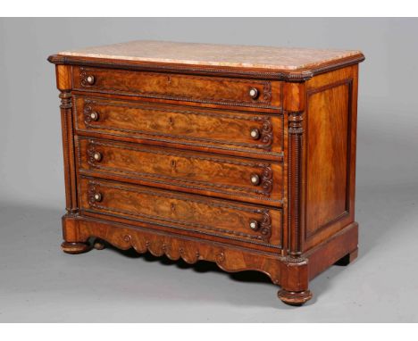 A LARGE CONTINENTAL MARBLE TOPPED AND MAHOGANY COMMODE, with four long graduated drawers flanked by columns terminating in fl
