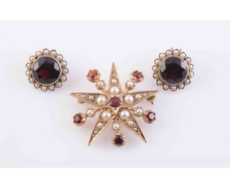 A GARNET AND SEED PEARL BROOCH, circa 1890-1900, formed as a five-pointed star, set with a single round cut garnet highlight 