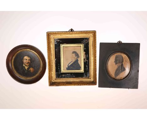 A GEORGIAN PORTRAIT MINIATURE OF A GENTLEMAN, watercolour on paper, in a verre eglomise frame, overall 17cm by 15cm; together