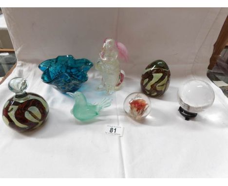 A glass rabbit, 4 glass paperweights, a glass dish and a glass globe