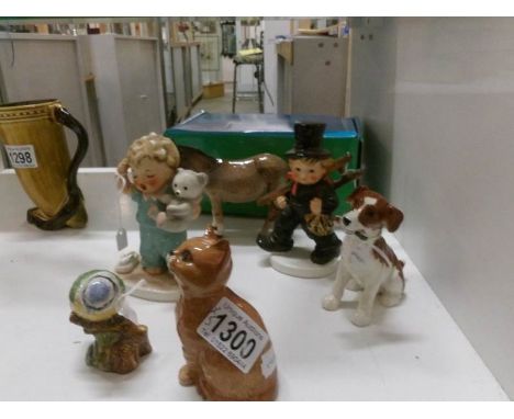 A boxed John Beswick donkey, a Beswick dog, cat and blue tit and 2 Goebel figures