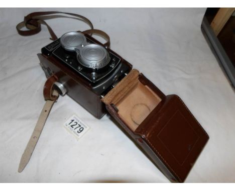 A leather cased Roliecord camera