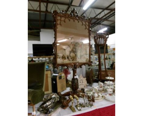 A Regency rosewood ornately carved fire screen with tapestry inset depicting child on pony, dog etc