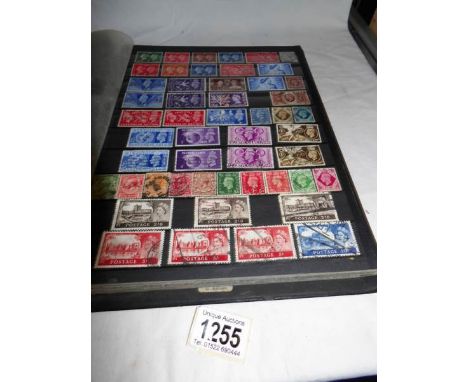 An album of stamps including over 70 mint commemorative sets dated back to 1964 and many used in a stock album together with 