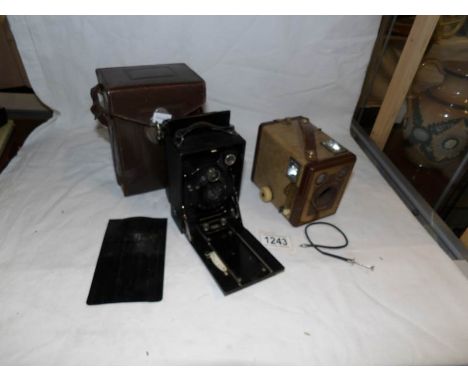 A leather cased Zeiss Ikon camera and a Kodak Brownie camera