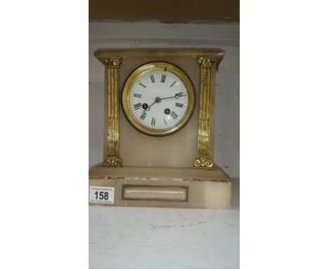 A white marble mantel clock