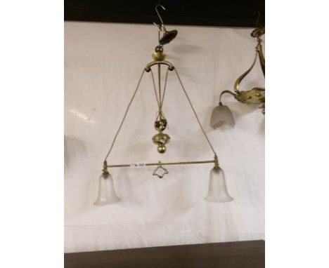 An Edwardian rise and fall brass ceiling light