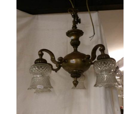 An Edwardian brass 5 arm ceiling light with cut glass shades