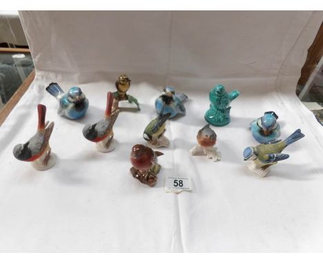A collection of bird figures including Beswick and Goebel