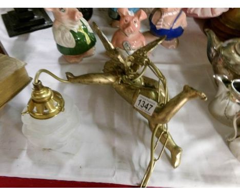 A gilded cherub ceiling light