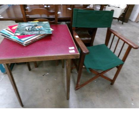 A folding card table with leather top and a director's chair