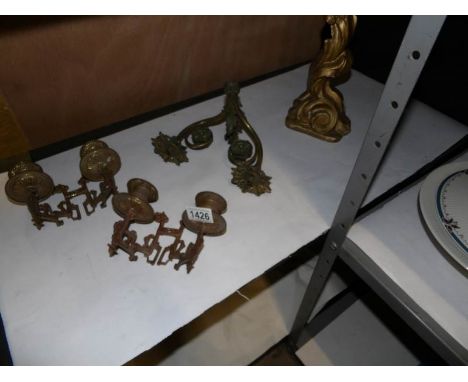 3 brass wall sconces and a gilded table lamp base