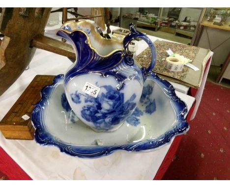 A blue and white jug and basin set