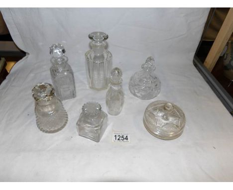 6 glass bottles and a trinket pot