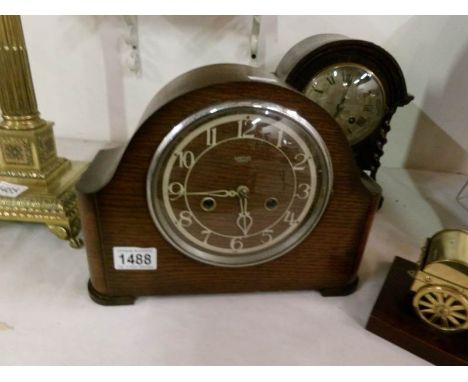 A Smith's Enfield mantel clock in working order and with key and pendulum