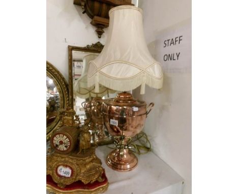A copper samovar converted to a table lamp