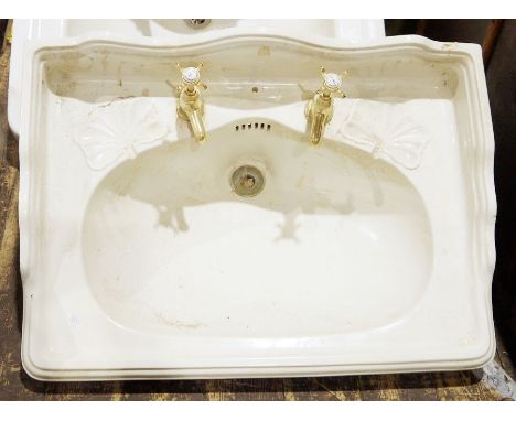 Vintage cast iron and enamel sink, two vintage ceramic sinks, two cisterns,&nbsp;two sink pedestals&nbsp;and assorted plumbin